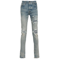 FLEX SHOP Amiri clay indigo distressed jeans with whiskering, front rips, and contrast underlay detailing.