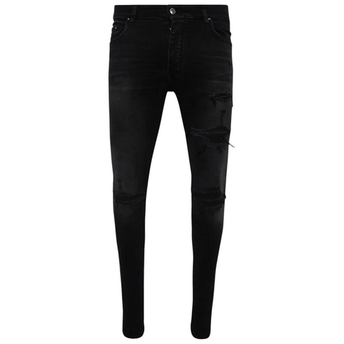 FLEX SHOP Amiri vintage black distressed denim jeans with rips and whiskering details.