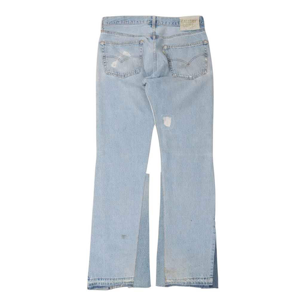 FLEX SHOP Gallery Dept. light blue distressed flare jeans with vintage-inspired worn detailing and back patch label.