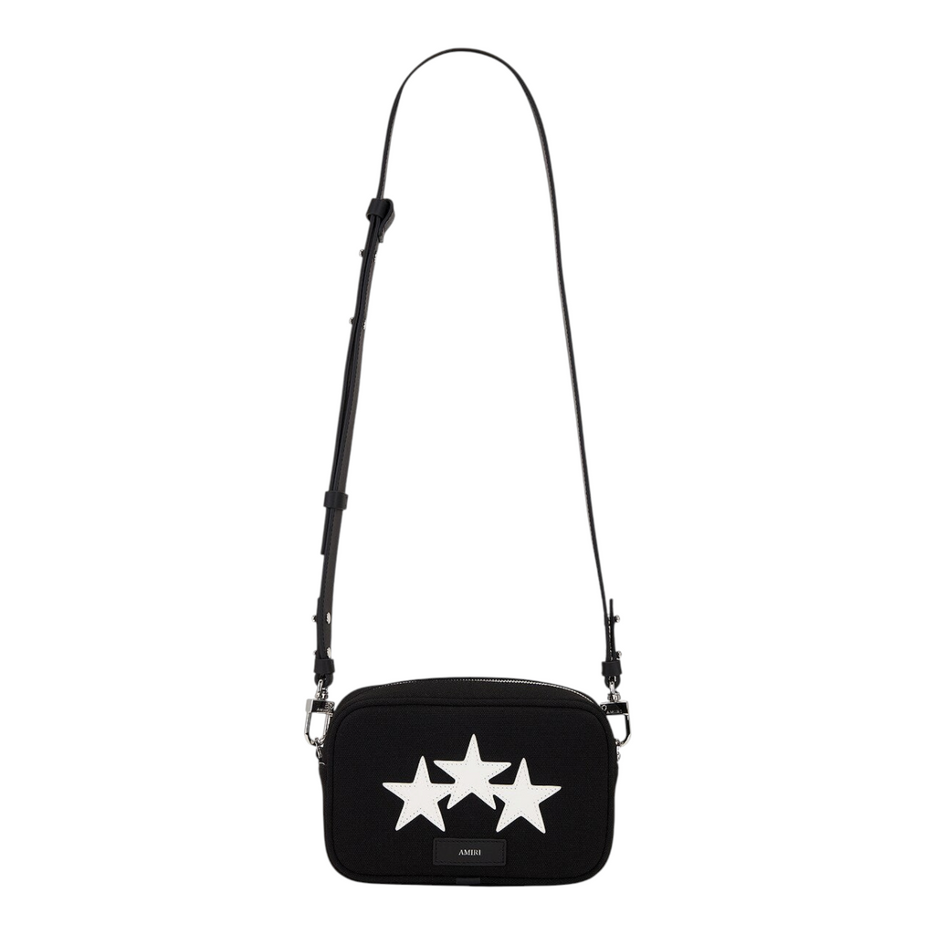 FLEX SHOP Amiri black messenger bag featuring three white star appliqués and an adjustable shoulder strap