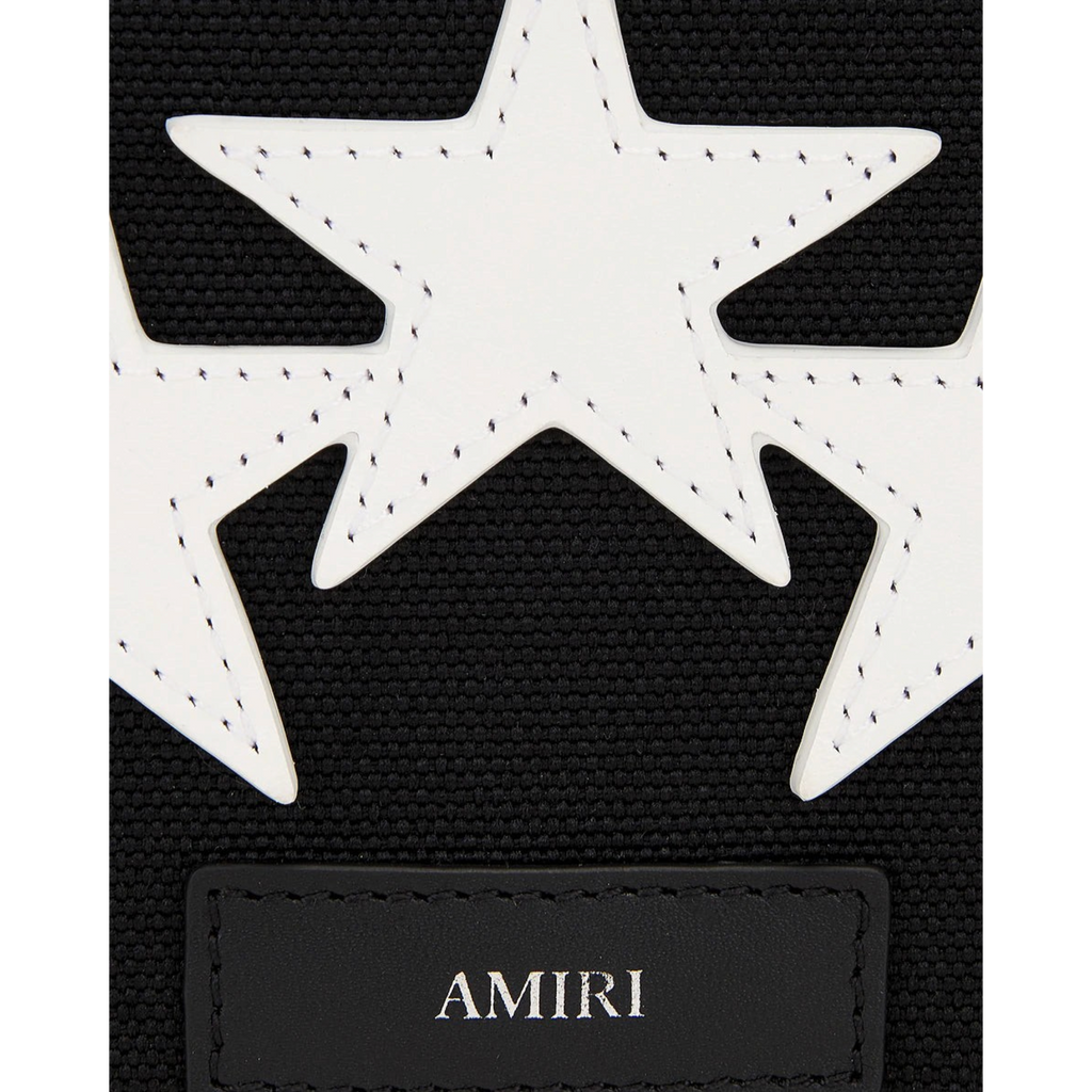 FLEX SHOP Amiri black messenger bag featuring white leather star appliqués and a debossed brand logo patch