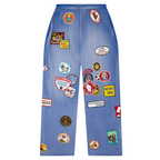 FLEX SHOP blue waffle-knit sweatpants featuring a relaxed fit and various vintage-style embroidered patches.
