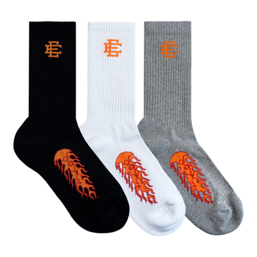 FLEX SHOP Eric Emanuel 3 pack crew socks in black, white, and grey with orange flame graphics and EE logo branding.