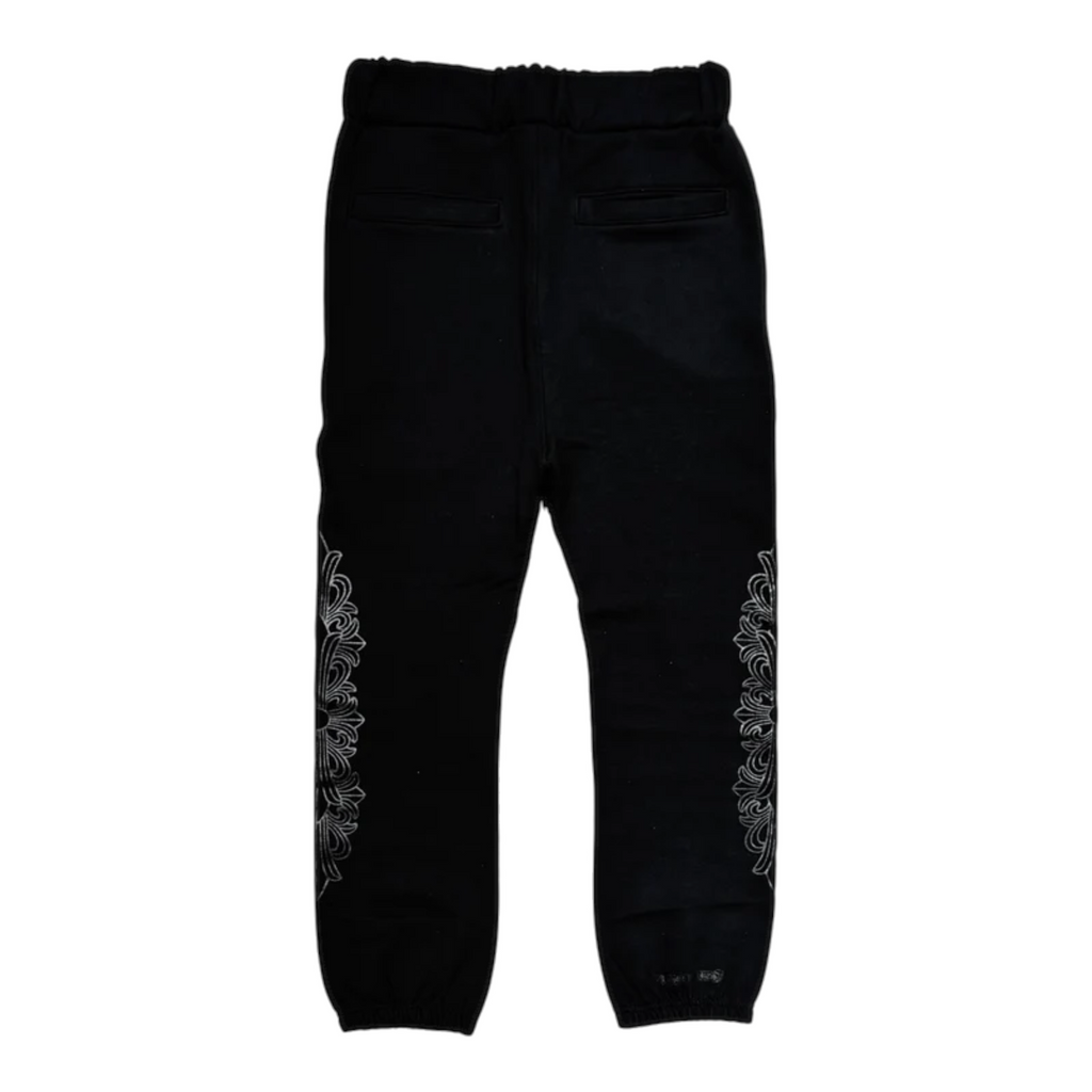 FLEX SHOP black sweatpants featuring white floral cross side prints and an elastic waistband for streetwear style.