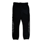 FLEX SHOP black sweatpants featuring white floral cross side prints and an elastic waistband for streetwear style.