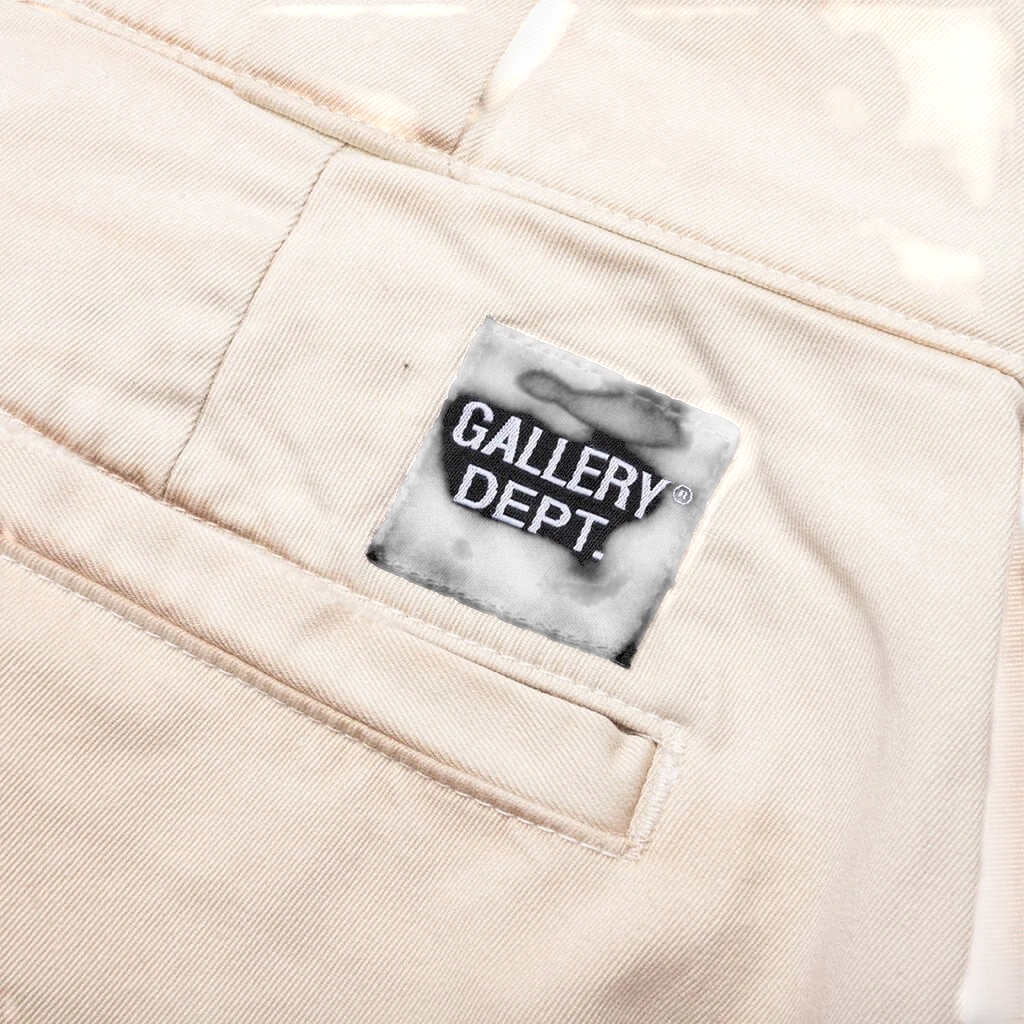 FLEX SHOP Gallery Dept. La Chino Flares in antique white cotton twill featuring a black logo patch on the back pocket.