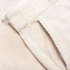 Close-up of FLEX SHOP Gallery Dept. La Chino Flares in antique white Japanese cotton twill with side pocket detail.