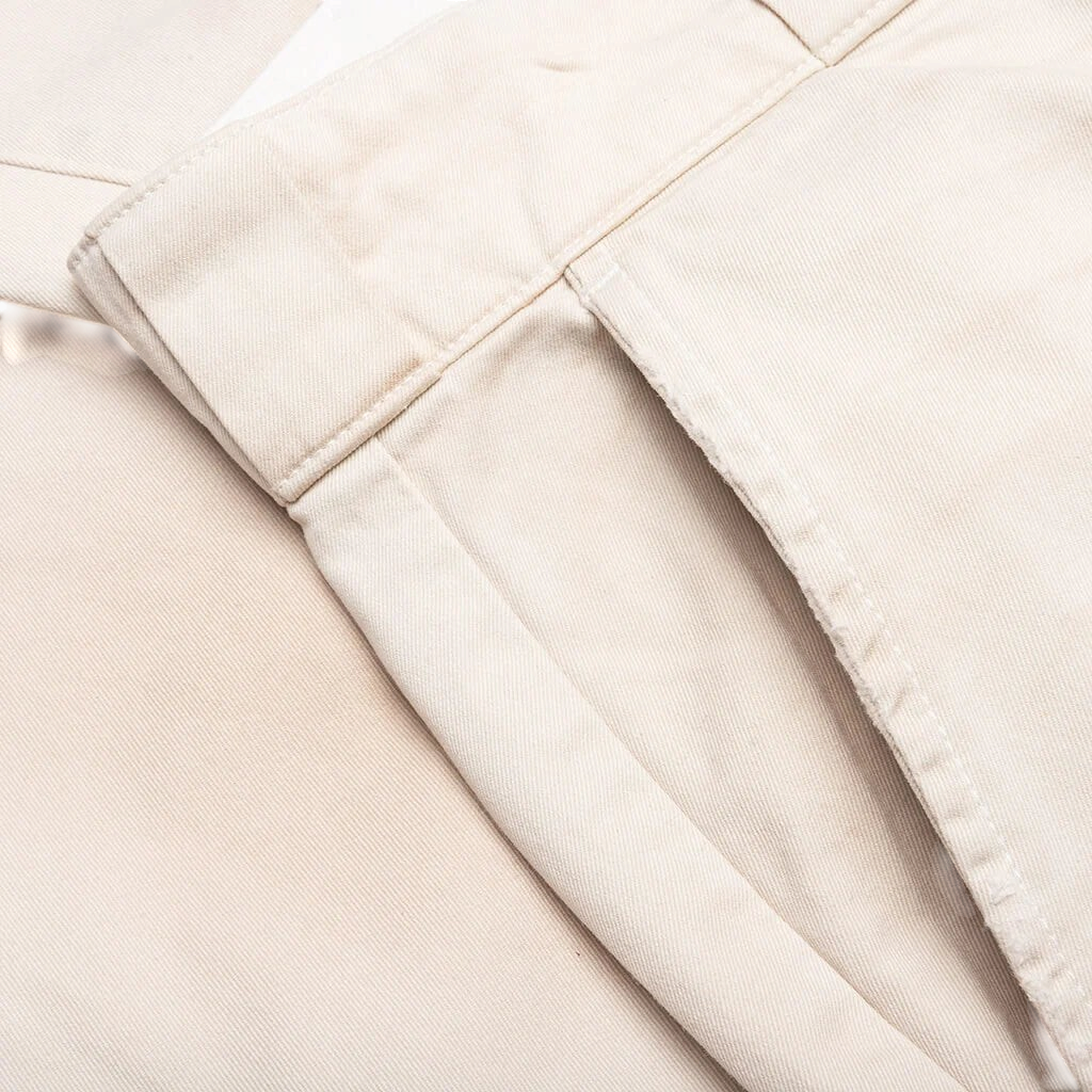 Close-up of FLEX SHOP Gallery Dept. La Chino Flares in antique white Japanese cotton twill with side pocket detail.
