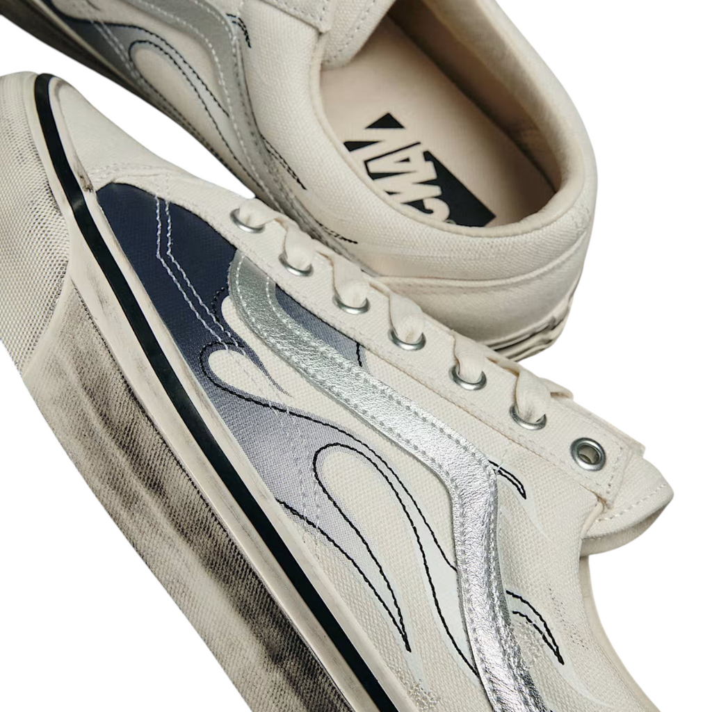 FLEX SHOP Vans Premium Old Skool LX sneakers in white canvas and leather with metallic silver flame graphic details.