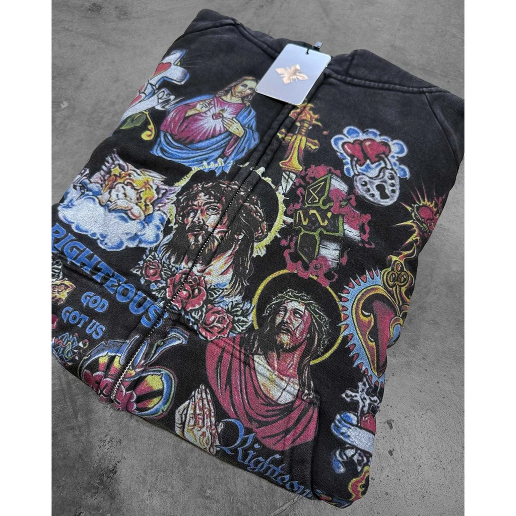 FLEX SHOP black zip-up hoodie featuring vibrant Risen King religious graphic prints and a full-length front zipper.