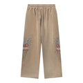 FLEX SHOP Righteous Sacred Heart brown sweatpants with graphic wing and heart design on the legs.