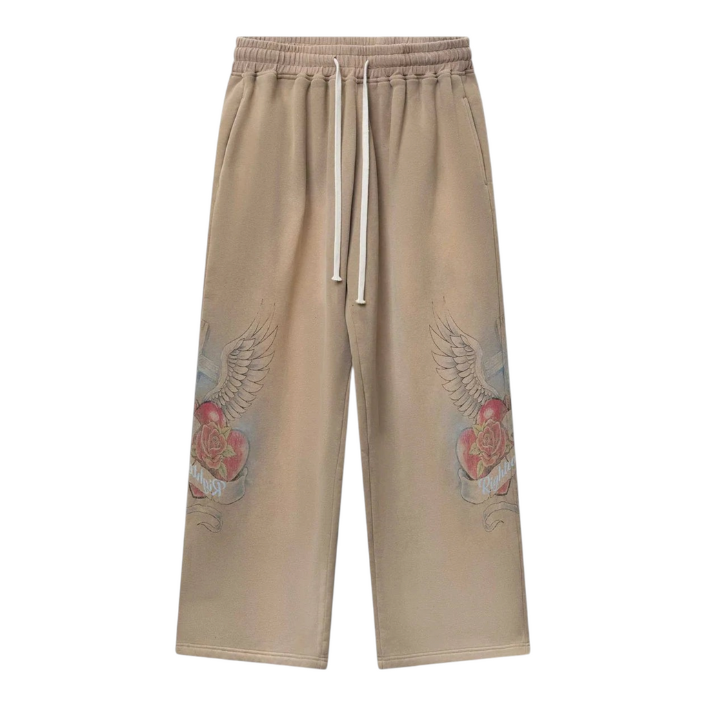 FLEX SHOP brown sweatpants featuring a Sacred Heart graphic with wings and roses on the legs and a drawstring waist.