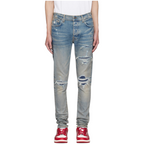 FLEX SHOP Amiri Clay Indigo distressed jeans with whiskering, contrast underlay rips, and logo appliqué detail.
