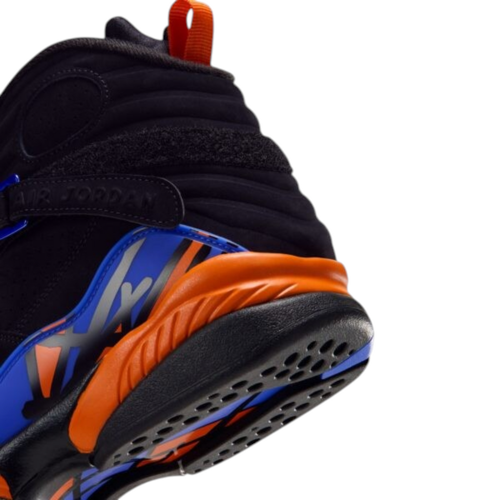 FLEX SHOP Air Jordan 8 Knicks sneaker featuring black nubuck, royal blue overlays, and orange midsole detailing.